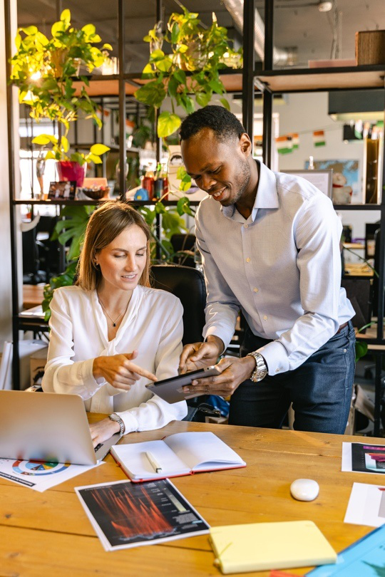 Two Employees Work Together.