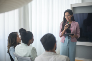 A Woman Teaches Employees.