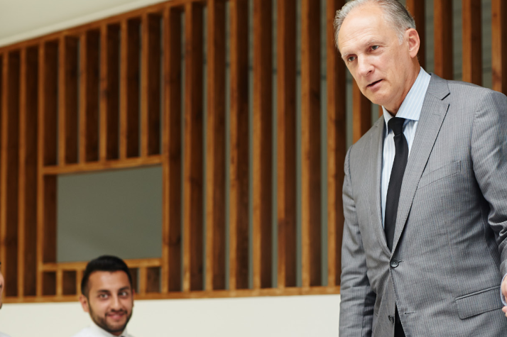 A man leading a conference